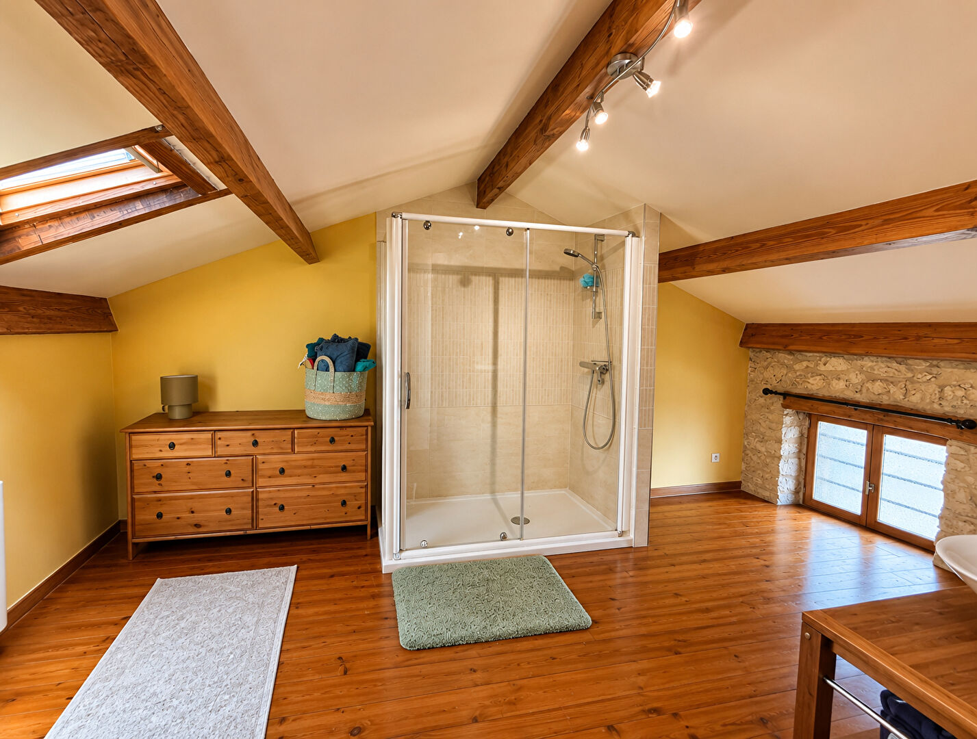 Charming property in Tarn-et-Garonne, Occitanie, featuring a cosy bedroom with wooden details and a swimming pool outside.