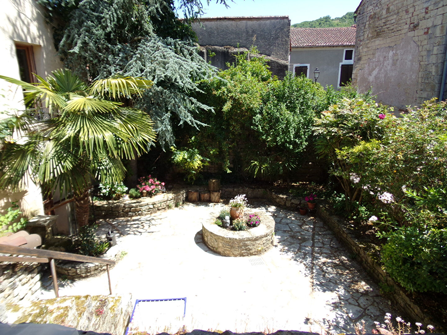 Charming property with a landscaped garden featuring stone pathways and lush greenery in Lot, Occitanie, 46220.