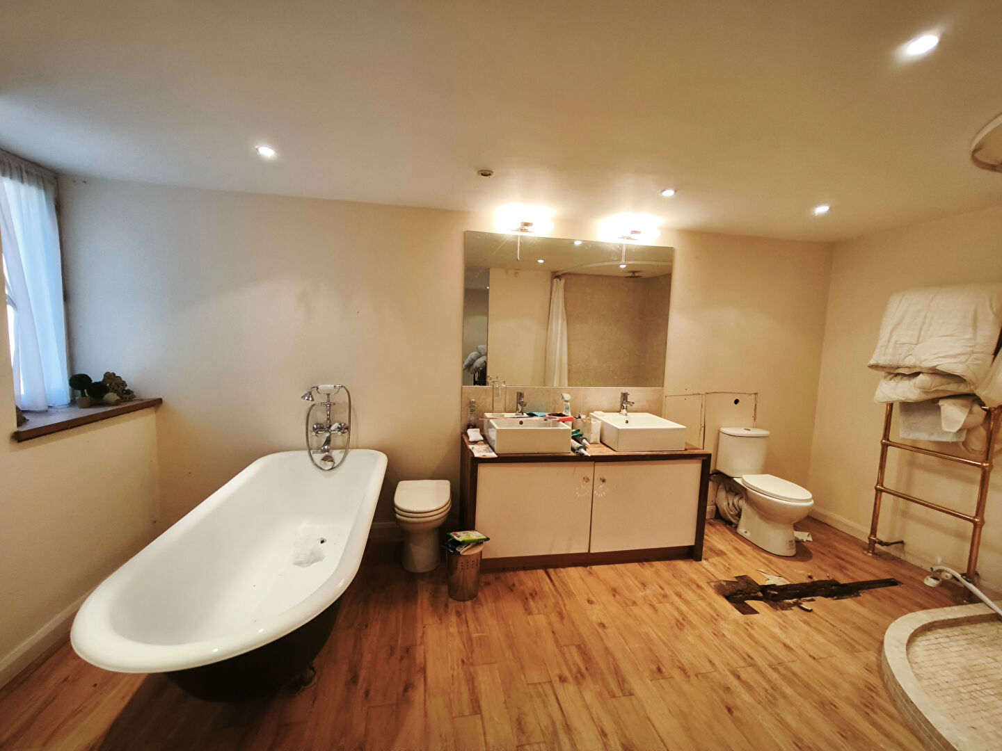 Spacious bathroom featuring a freestanding bath and modern fixtures in Morbihan, Brittany, 56540.