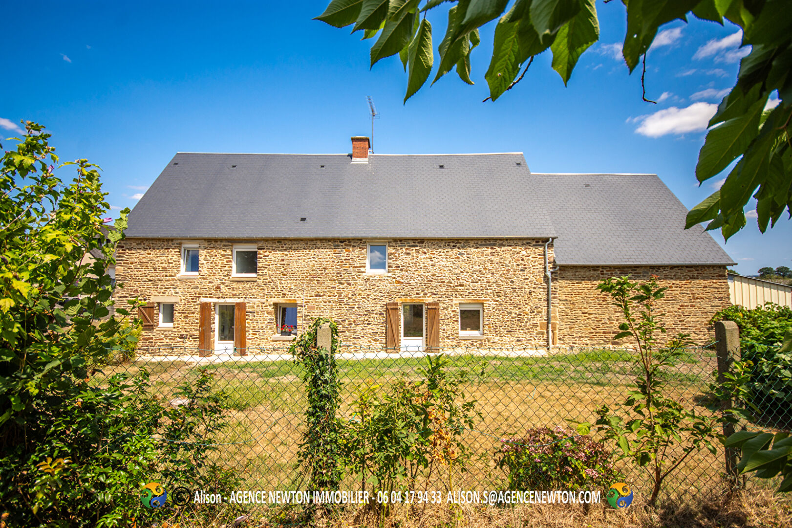 Four-bedroom property in Manche, Normandy, featuring a stone exterior and garden space.