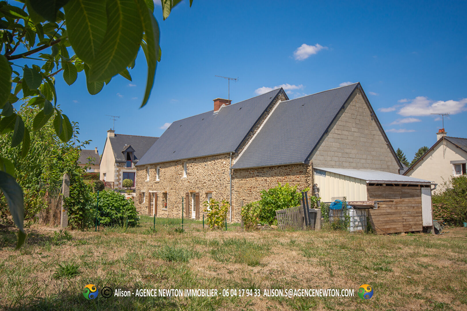 Four-bedroom property in Manche, Normandy, featuring a stone façade and spacious garden area.