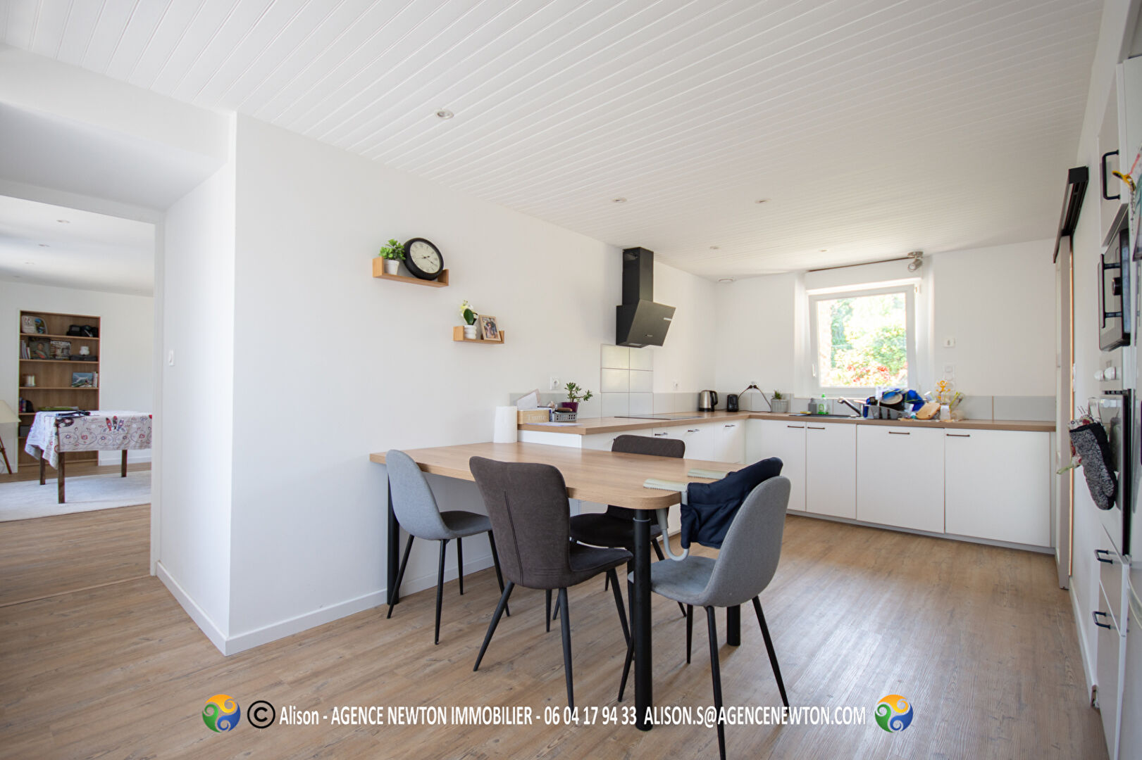 Modern property in Manche, Normandy featuring a bright kitchen and dining area with contemporary furnishings.