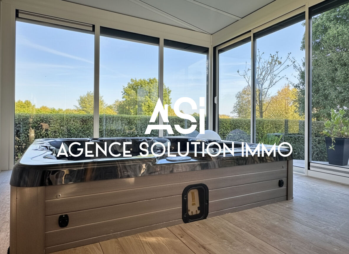 MAISON DE PLAIN PIED AVEC DEUX GARAGES