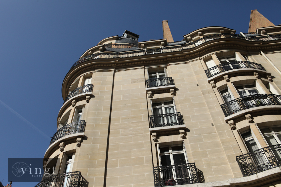 Elegant property in Paris, Île-de-France, featuring classic architecture and intricate balconies.